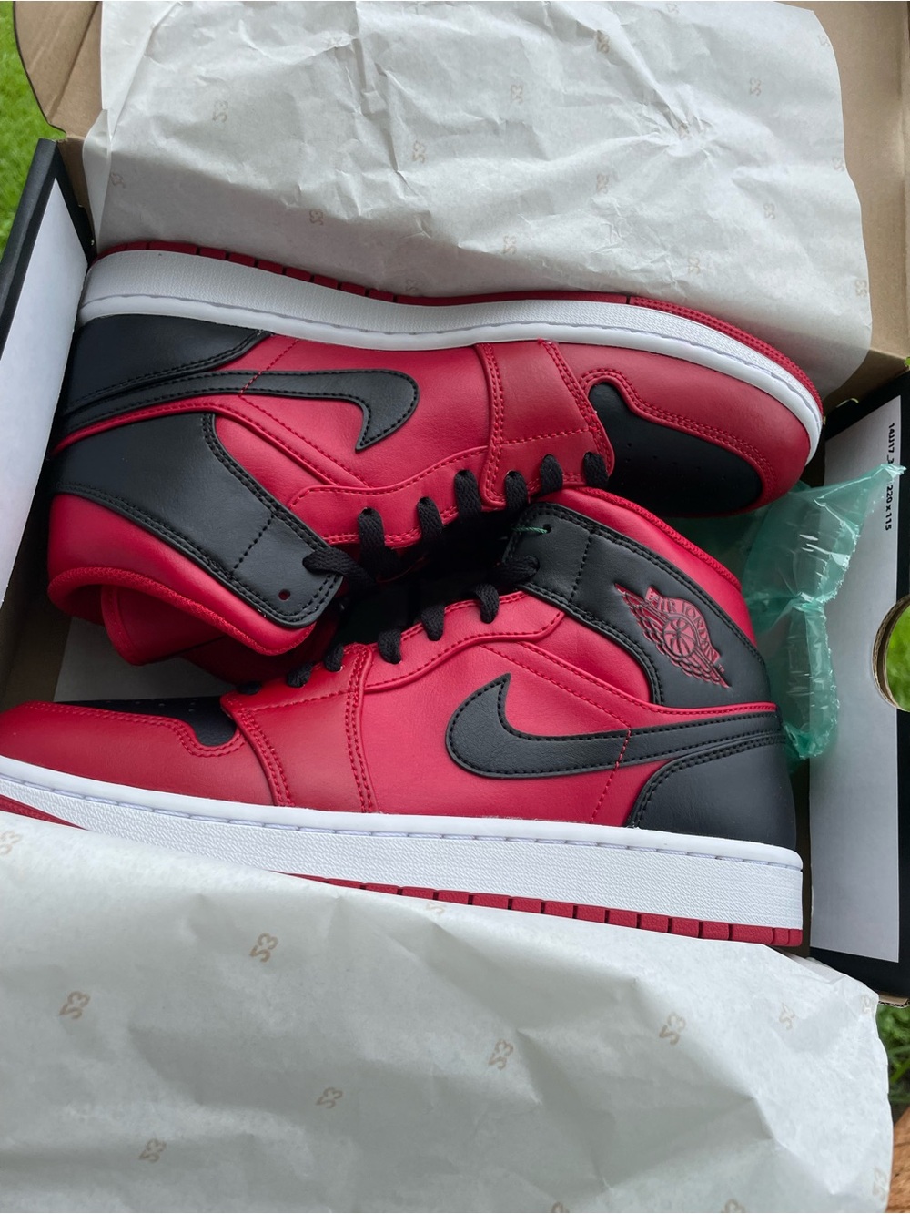 Nike Air Jordan 1 Mid Red and Black Leather Sneakers
